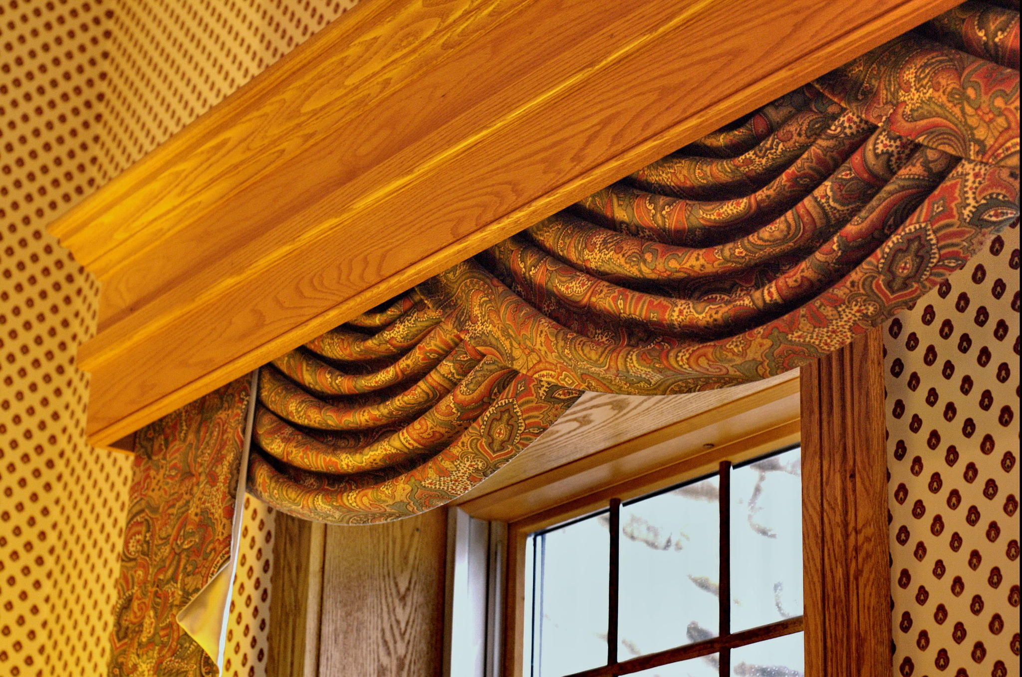 window treatment with swag curtain and cornice